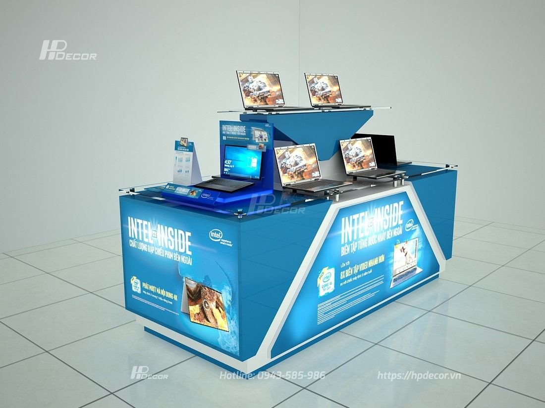 Đảo trưng bày máy tính xách tay với bàn kính và hộp đèn Mica, thu hút sự chú ý của khách hàng