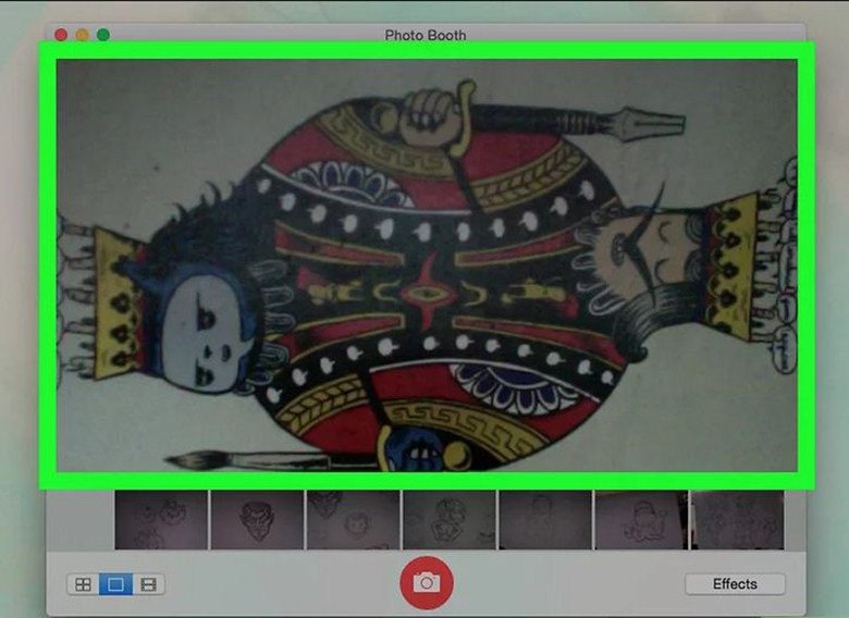 Đèn báo màu xanh lá cạnh camera laptop Macbook khi ứng dụng Photo Booth hoạt động