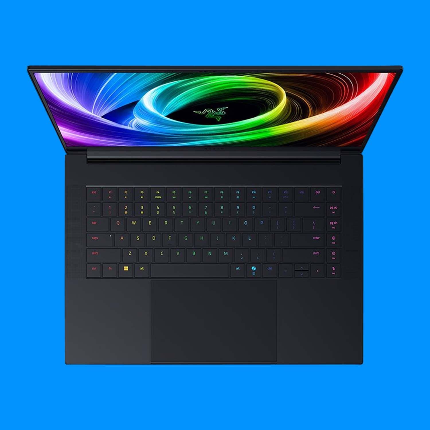 Hình ảnh laptop chơi game Razer Blade 16 (2025) màu đen, nhìn từ trên xuống, trên nền xanh lam, thể hiện thiết kế sang trọng và hiện đại