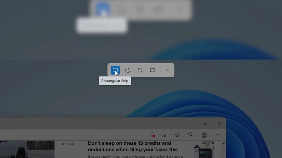 Người dùng đang chọn vùng chụp màn hình hình chữ nhật trên laptop Windows 11 bằng Snipping Tool.