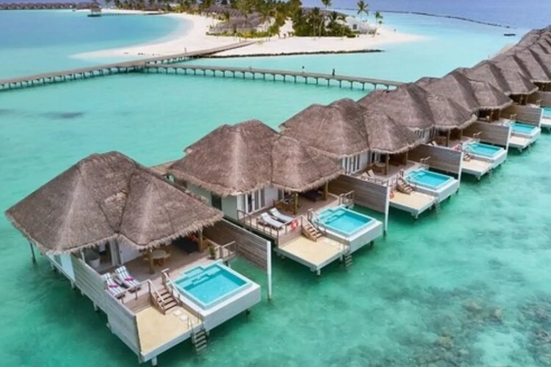 Maldives Thuộc Nước Nào? Khám Phá Thiên Đường Biển Đảo 2026 Biển xanh và các nhà gỗ trên mặt nước ở Maldives
