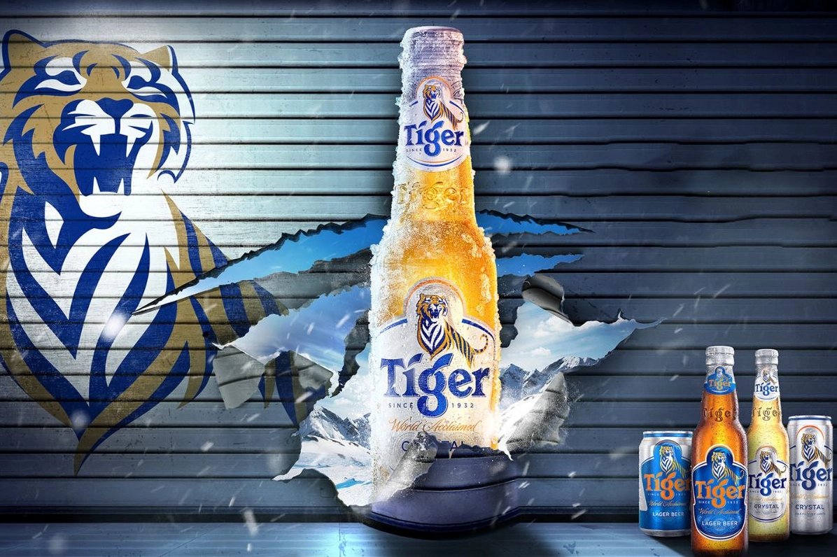 Bia Tiger của nước nào? Lịch sử và Sự phát triển toàn cầu Ly bia Tiger vàng óng cạnh lon bia